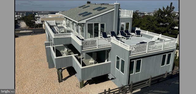 1039 Long Beach Blvd, Long Beach Township, NJ 08008 - rear view of property with a balcony and roof with shingles