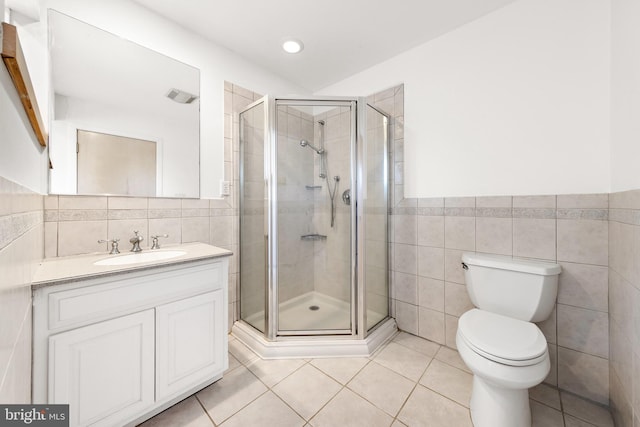 1039 Long Beach Blvd, Long Beach Township, NJ 08008 - bathroom featuring tile walls, tile patterned floors, vanity, toilet, and a shower stall