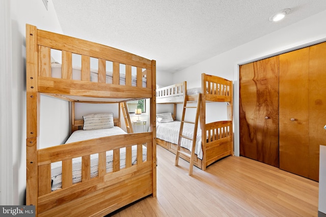 1039 Long Beach Blvd, Long Beach Township, NJ 08008 - unfurnished bedroom featuring a textured ceiling, wood finished floors, and a closet
