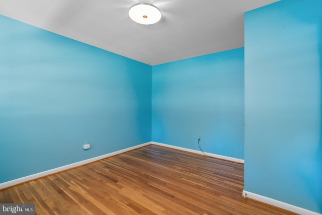 unfurnished room featuring wood-type flooring