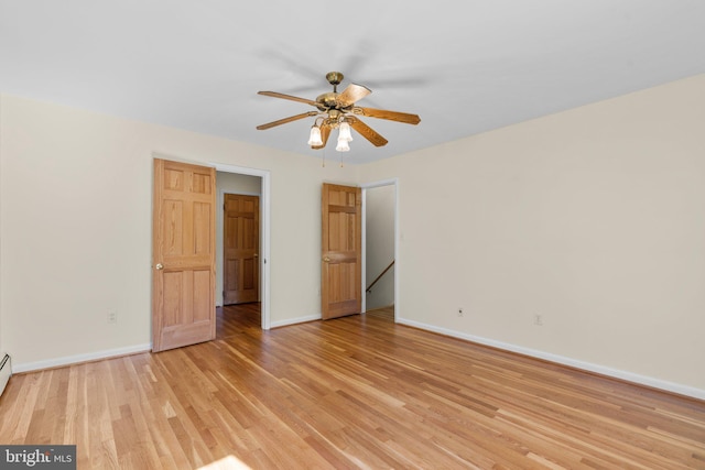 unfurnished bedroom with light hardwood / wood-style flooring and ceiling fan