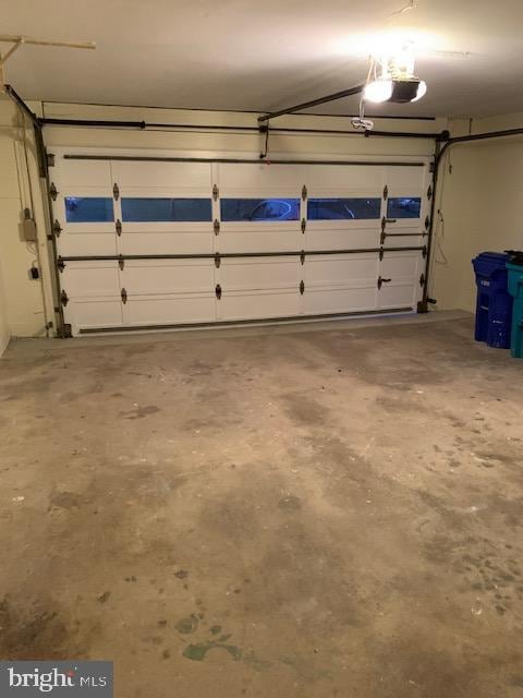 garage featuring a garage door opener