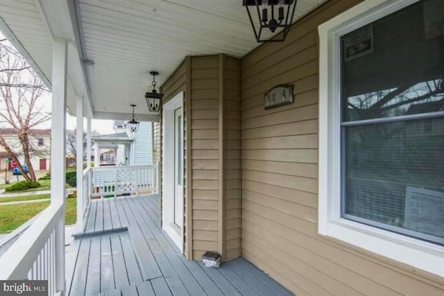 wooden terrace with a porch