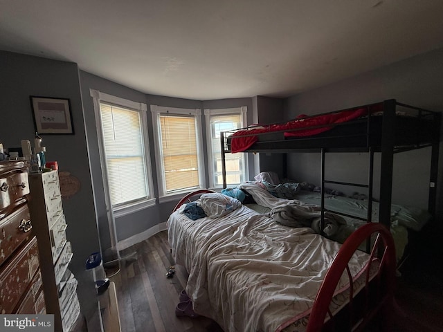 bedroom featuring dark wood-type flooring