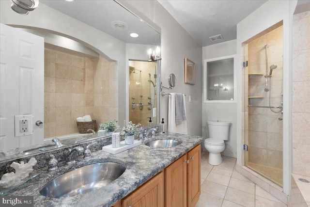 bathroom with toilet, an enclosed shower, vanity, and tile patterned flooring