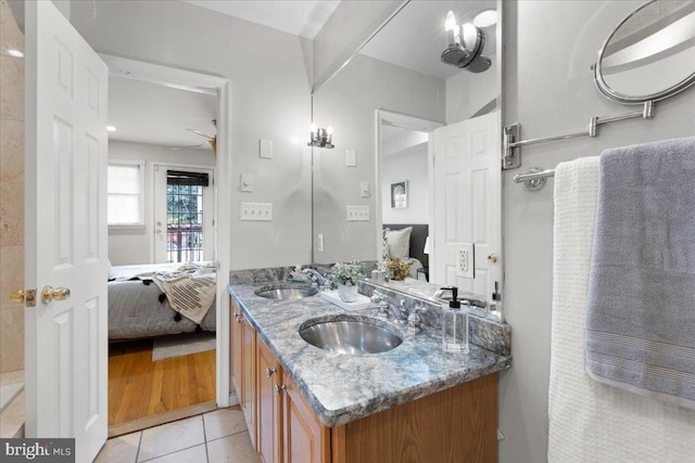 bathroom with vanity, ceiling fan, and tile patterned floors