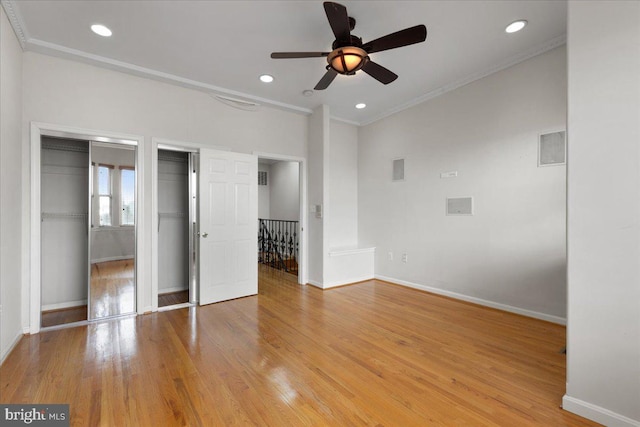 unfurnished bedroom featuring light hardwood / wood-style floors, ornamental molding, and ceiling fan