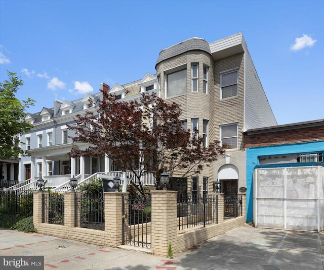 multi unit property featuring a garage