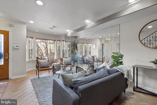 living room featuring crown molding and light parquet flooring