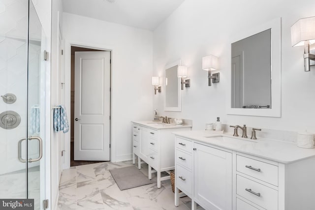 bathroom with a shower with door and vanity