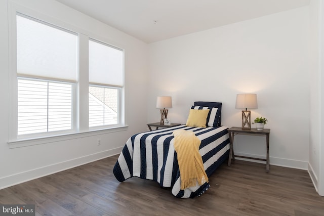 bedroom featuring dark wood-type flooring