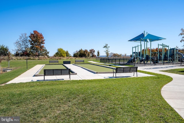 view of community with a yard and a playground