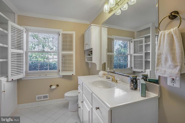 bathroom with toilet, vanity, visible vents, baseboards, and ornamental molding