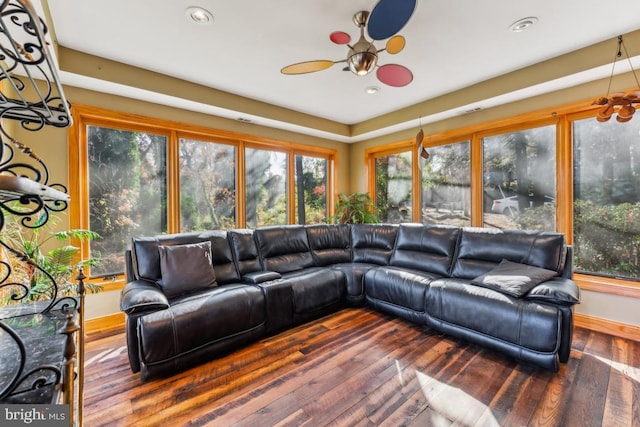 living room featuring hardwood / wood-style floors, ceiling fan, and a healthy amount of sunlight