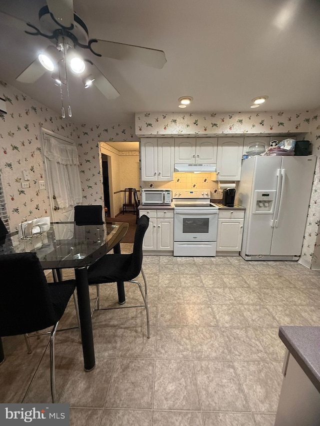 kitchen featuring white appliances and ceiling fan