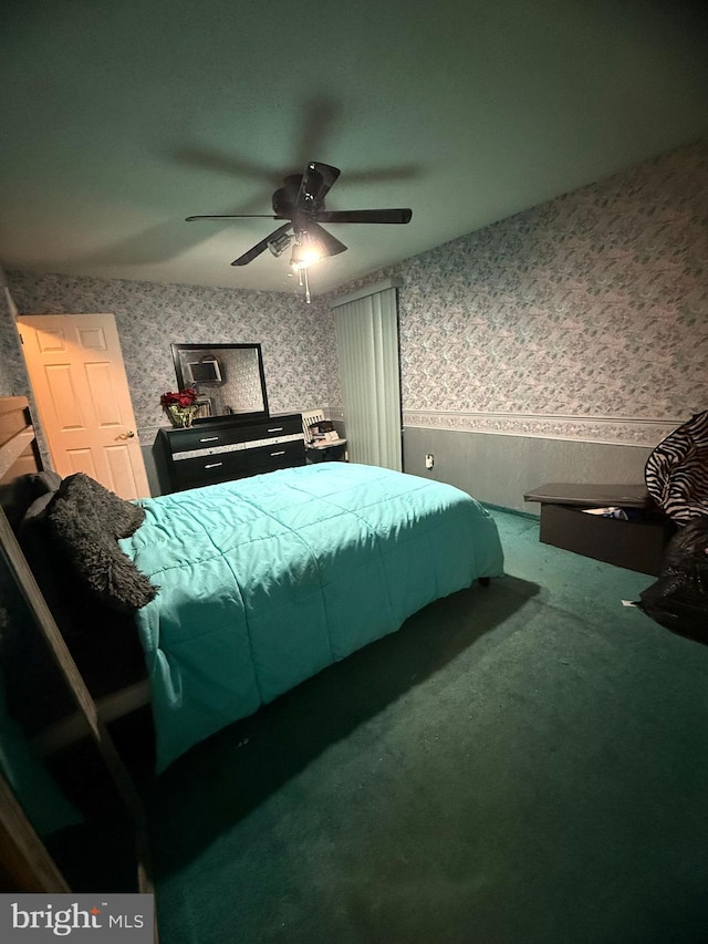 bedroom with ceiling fan and carpet floors