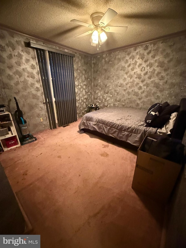 bedroom with a textured ceiling, ceiling fan, and ornamental molding