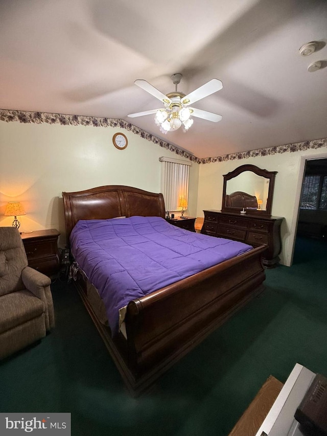 carpeted bedroom featuring vaulted ceiling and ceiling fan