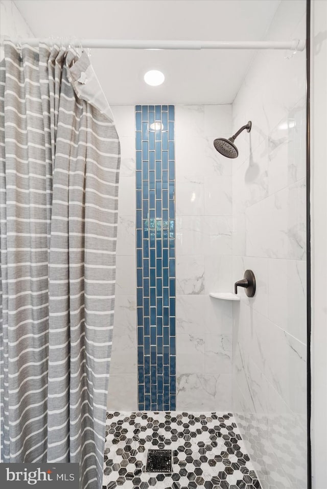 bathroom with a shower with shower curtain