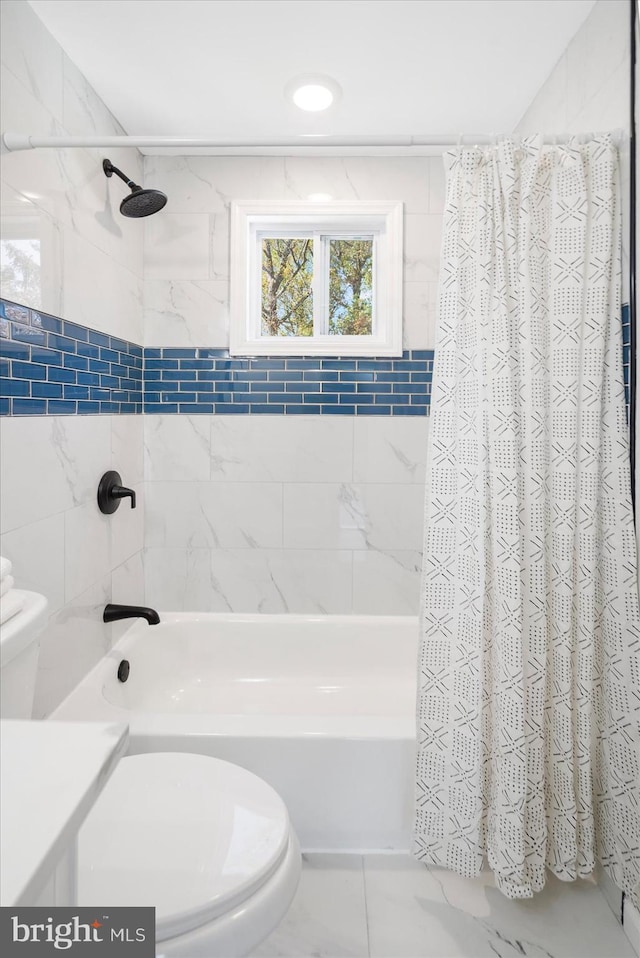 bathroom with toilet and shower / bath combo with shower curtain