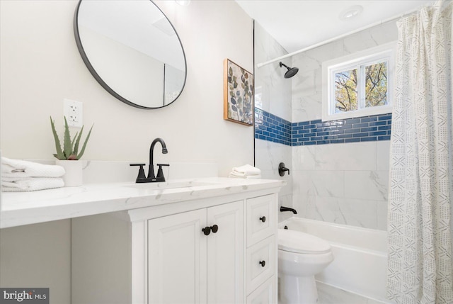 full bathroom with vanity, toilet, and shower / tub combo