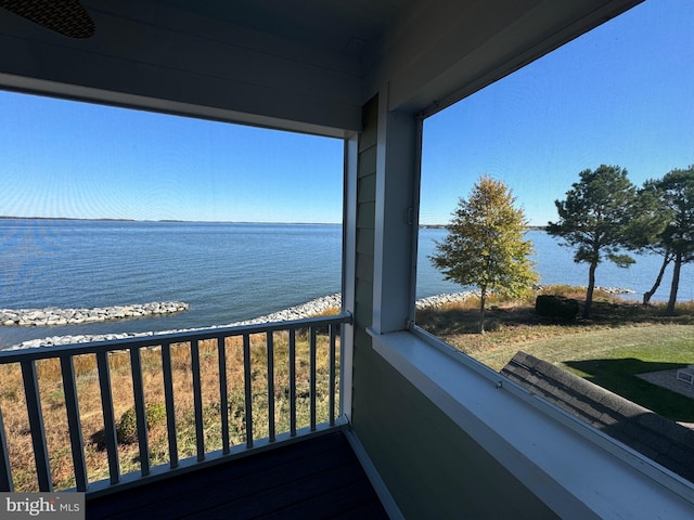 balcony featuring a water view