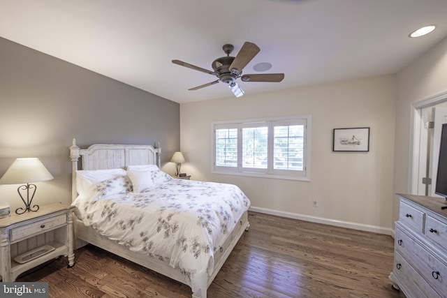 bedroom featuring ceiling fan and dark wood-type flooring