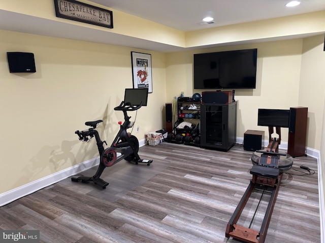 workout room with hardwood / wood-style flooring