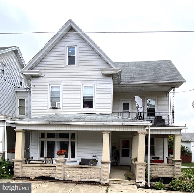 view of front of house featuring a porch and cooling unit