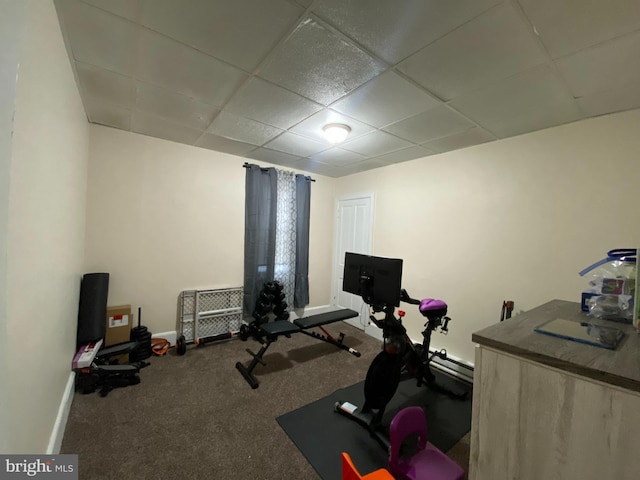 exercise area featuring a drop ceiling and carpet