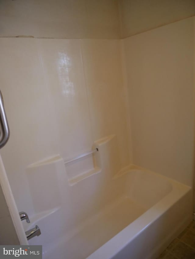 bathroom featuring tile patterned floors and tub / shower combination