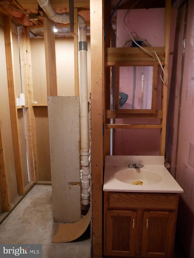 bathroom featuring vanity and concrete flooring