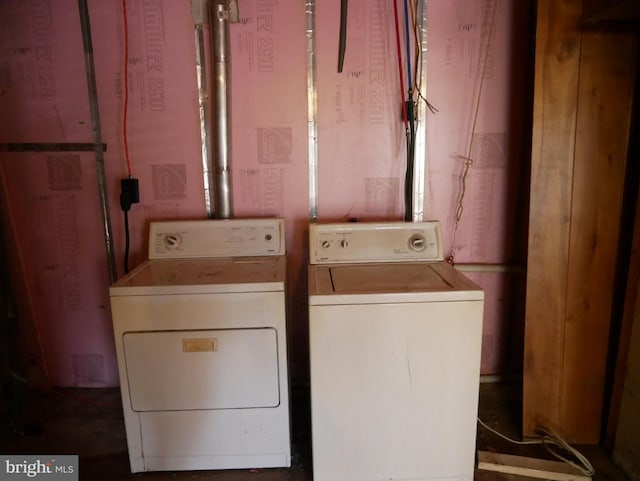 laundry room with washing machine and clothes dryer