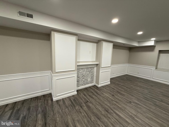 basement featuring dark wood-type flooring