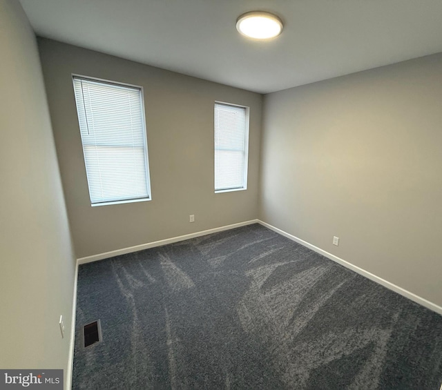 unfurnished room featuring carpet floors