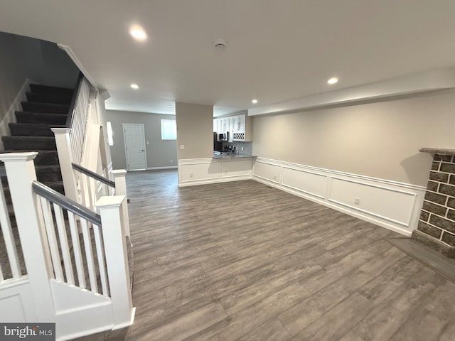 basement featuring dark wood-type flooring