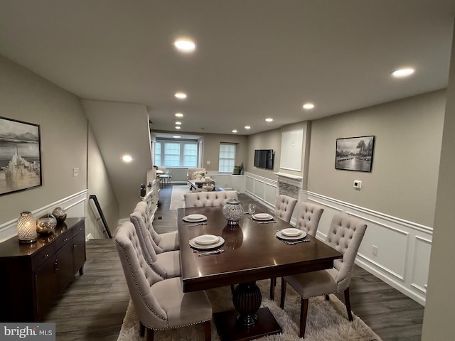 dining space featuring dark wood-type flooring