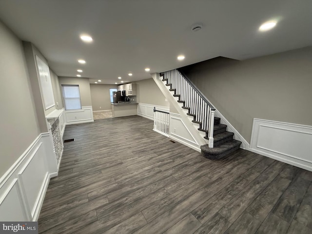 basement featuring dark wood-type flooring