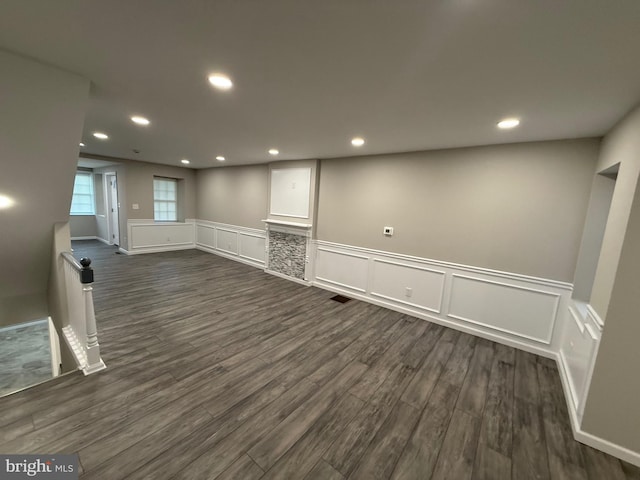 basement featuring dark hardwood / wood-style flooring