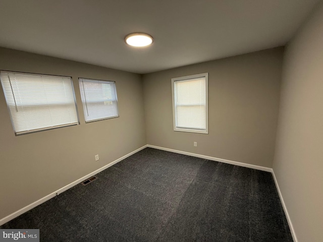 spare room featuring carpet floors