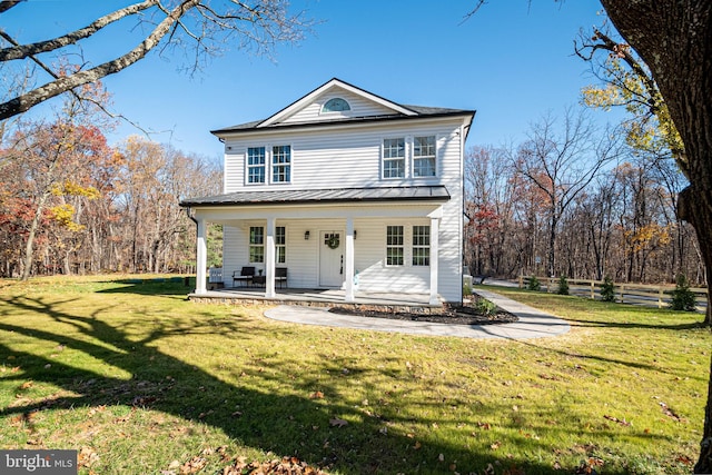 view of front of home with a front yard and a porch