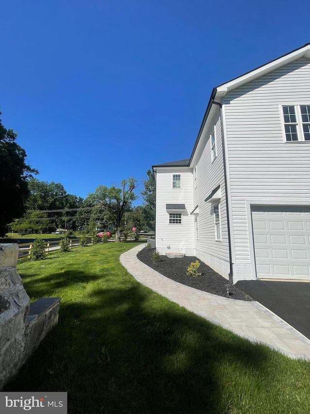 view of yard featuring a garage