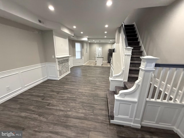 staircase featuring hardwood / wood-style flooring