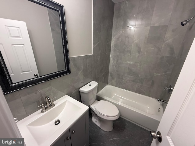 full bathroom with tasteful backsplash, vanity, bathing tub / shower combination, tile walls, and toilet