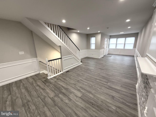 unfurnished living room with dark hardwood / wood-style floors