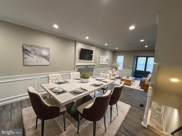 dining room featuring dark hardwood / wood-style floors and ornamental molding