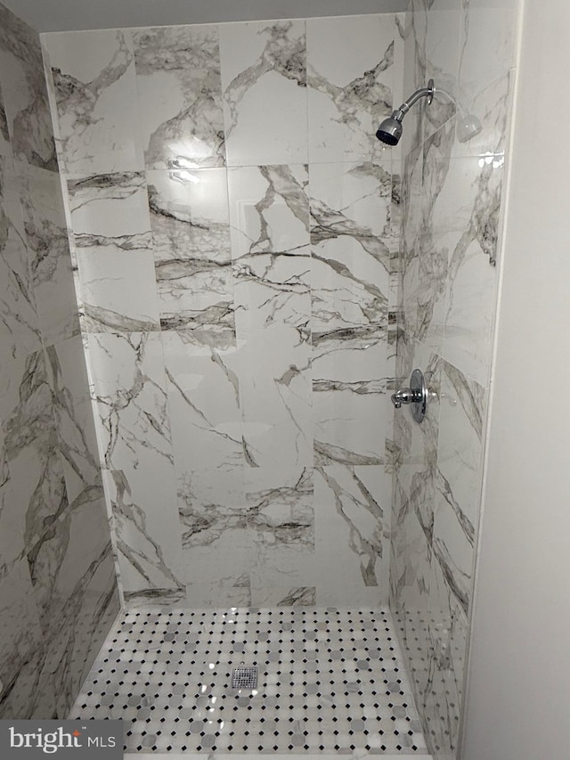 bathroom with a tile shower