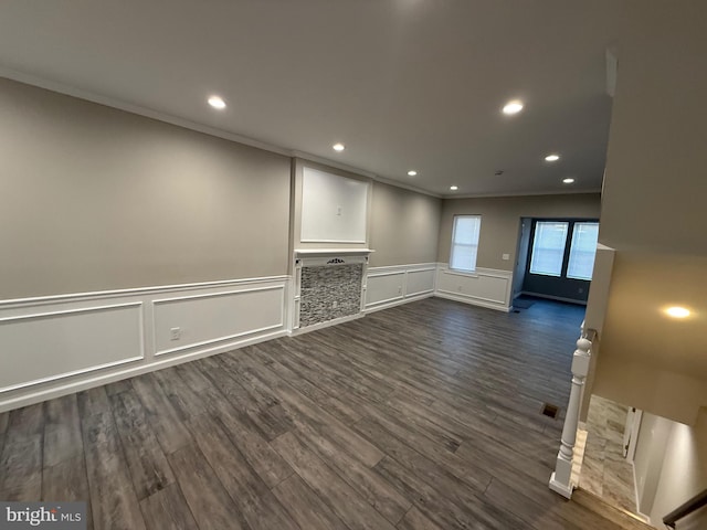 interior space featuring dark hardwood / wood-style floors and ornamental molding