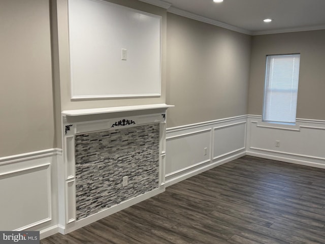 unfurnished living room featuring dark wood-type flooring and ornamental molding