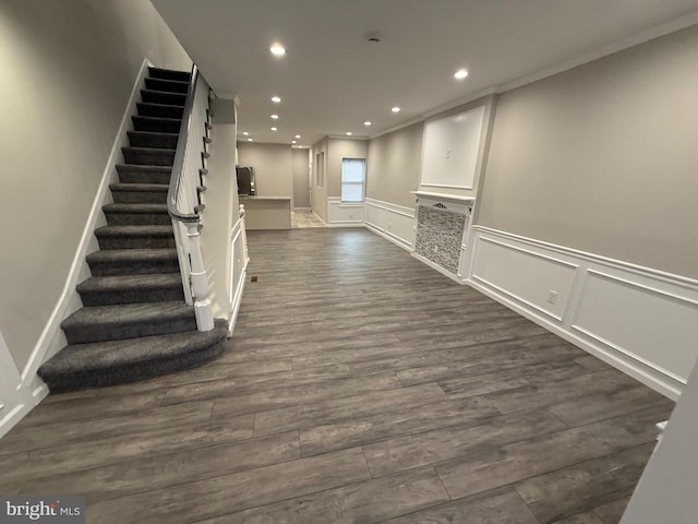 interior space featuring dark hardwood / wood-style flooring and crown molding